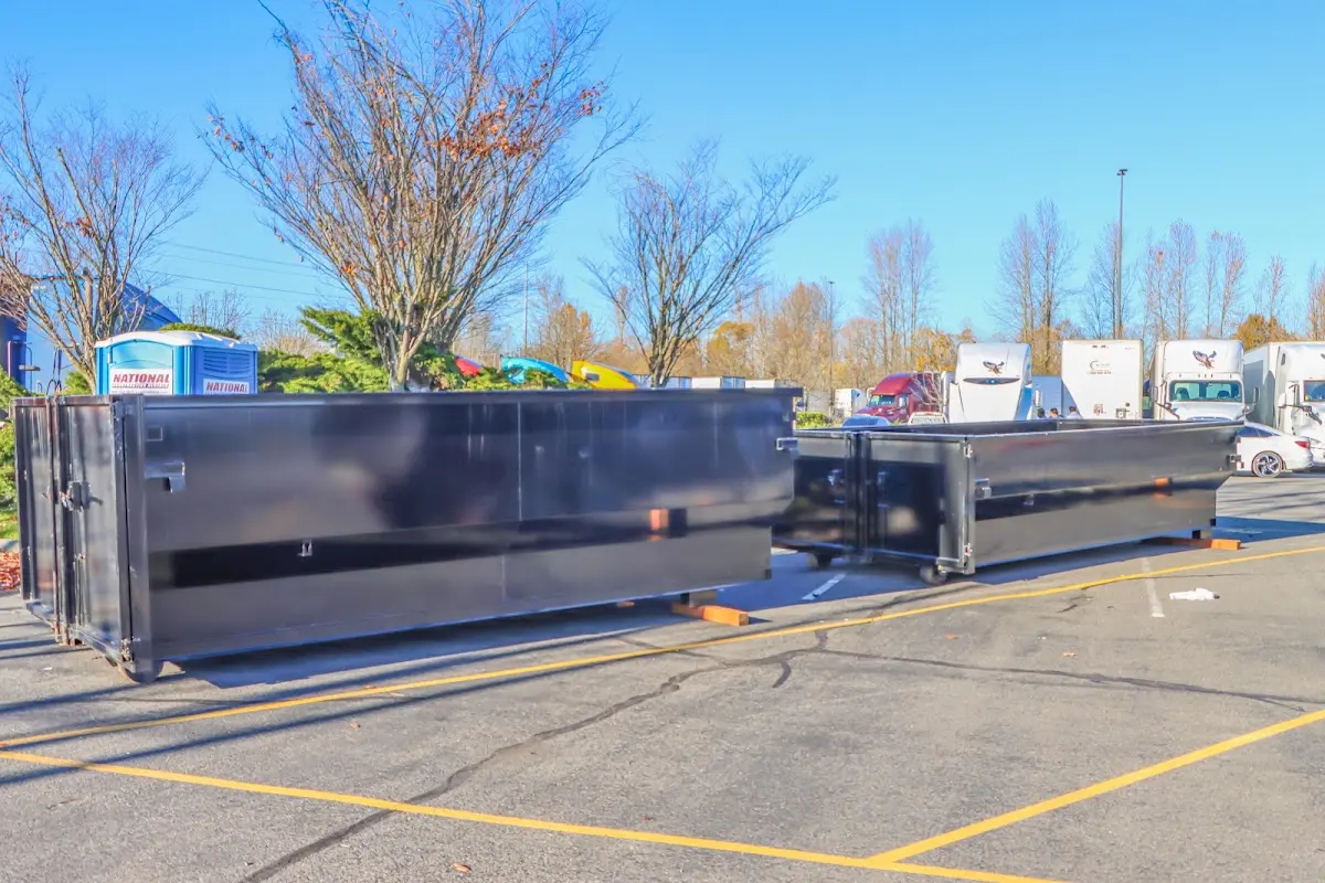 Professional dumpster rental service with roll-off container on residential driveway in West Chicago